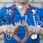 Healthcare provider in blue scrubs displaying a digital NAD+ graphic representing NAD+ IV therapy benefits and applications