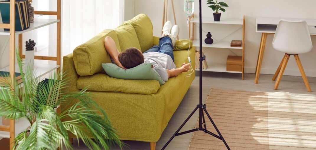 Person relaxing at home while receiving O3UV therapy for athletes