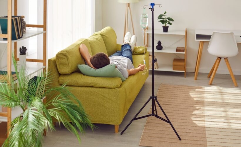 Person relaxing at home while receiving O3UV therapy for athletes
