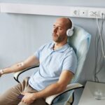 Person relaxing during ozone therapy for muscle soreness treatment