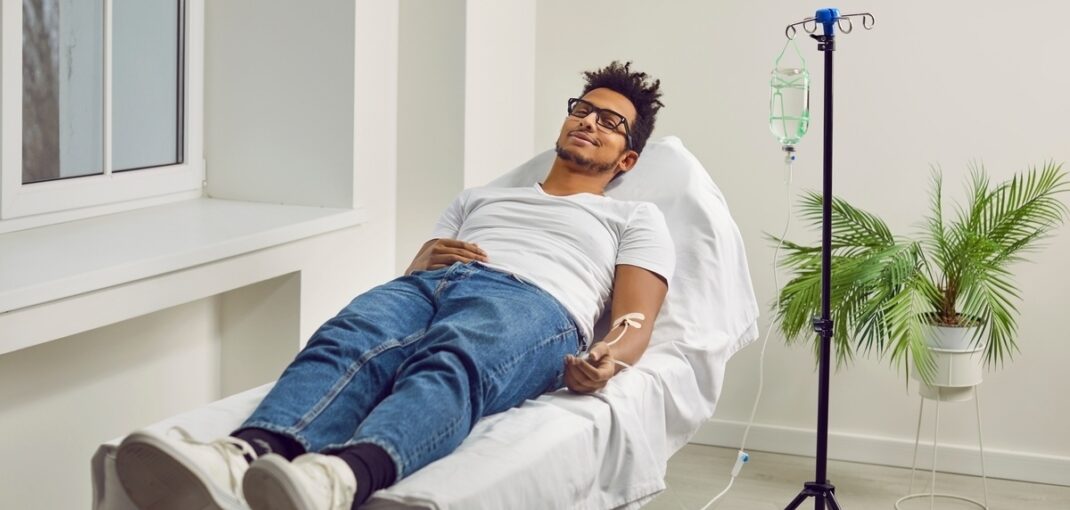 Person relaxing in a treatment chair during ozone therapy for sports injuries