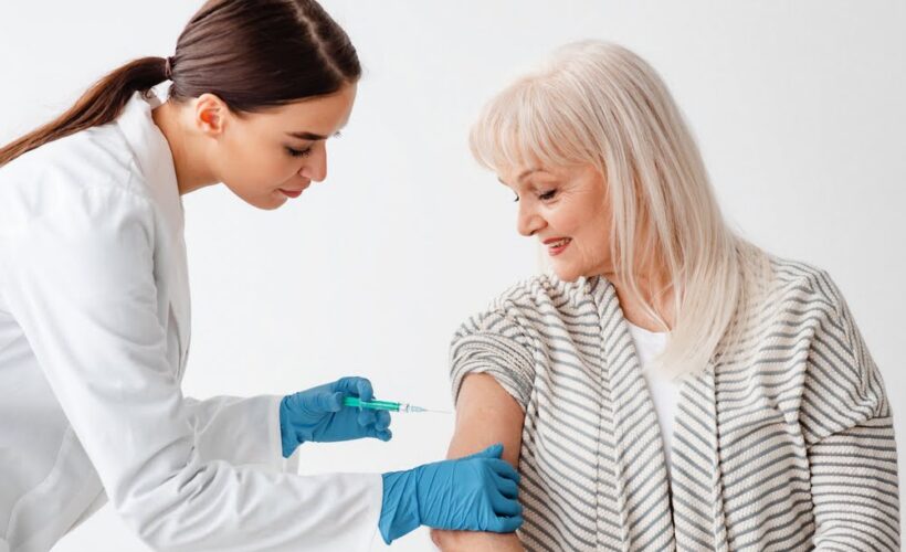 ozone therapy for autoimmune disease — provider administering treatment to an older female patient