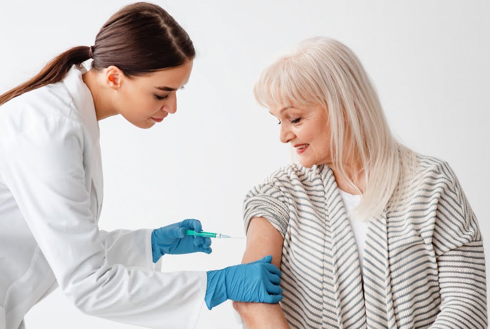 ozone therapy for autoimmune disease — provider administering treatment to an older female patient