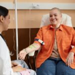 ozone therapy for cardiovascular health — patient receiving IV therapy session while consulting with her provider